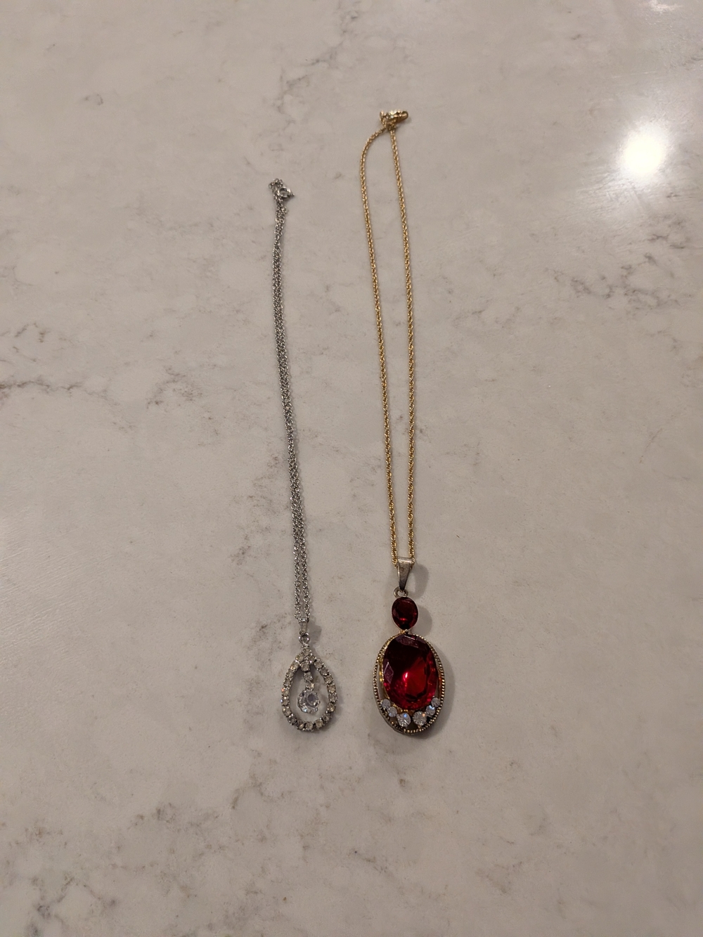 Gold-Tone Necklace with Red Oval Gem Pendant and Accent Stones